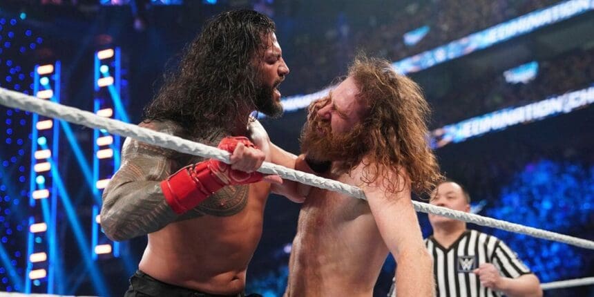 Roman Reigns shoving Sami Zayn's face